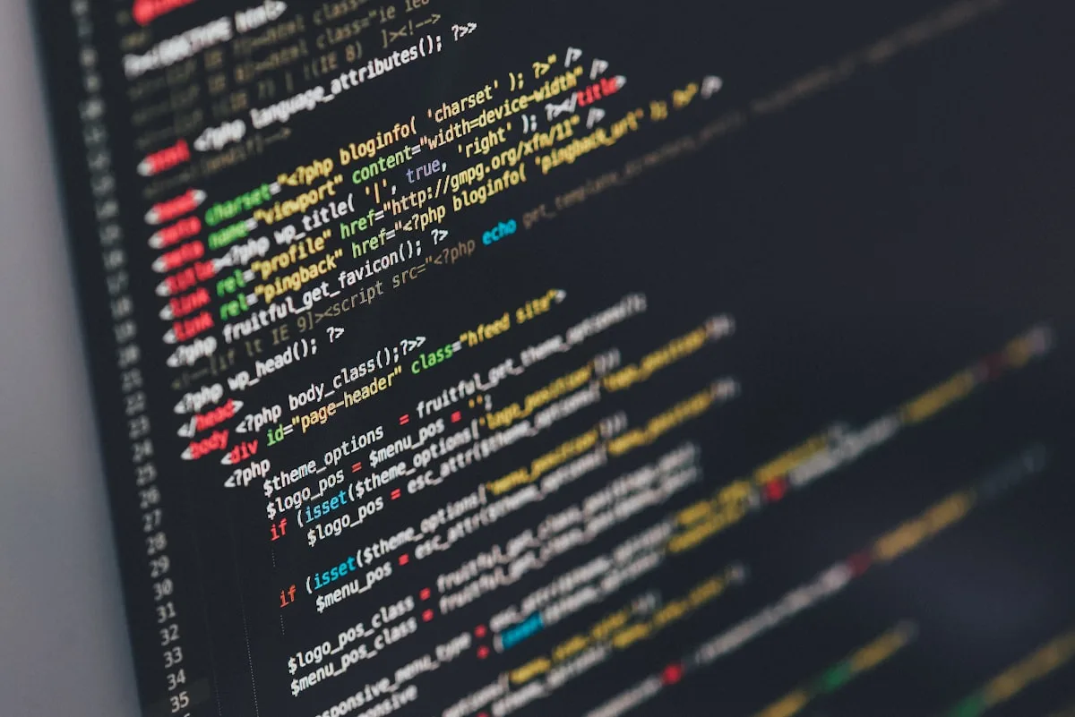 Developer working with PHP frameworks on a laptop